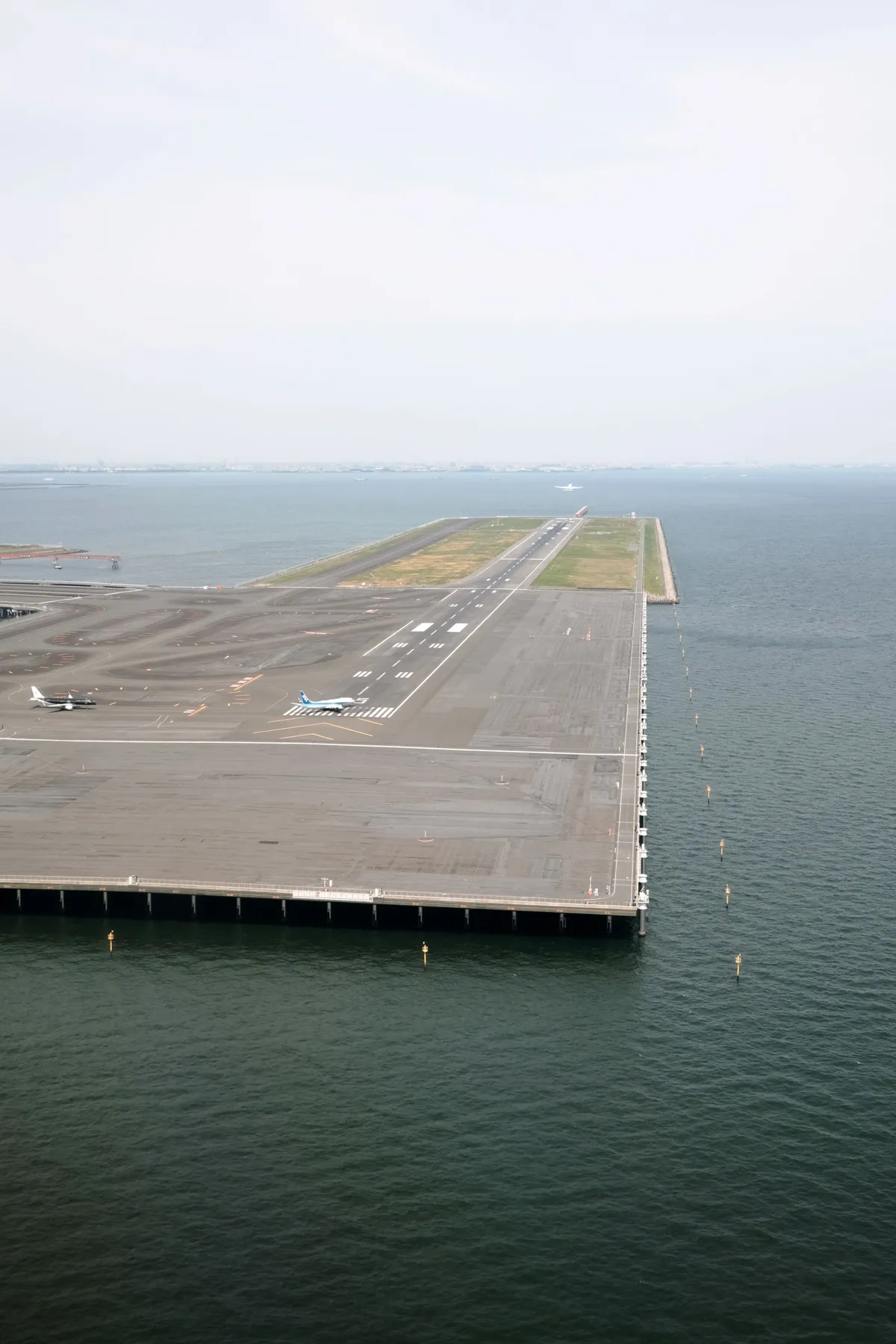 Airport runway extending into Tokyo Bay