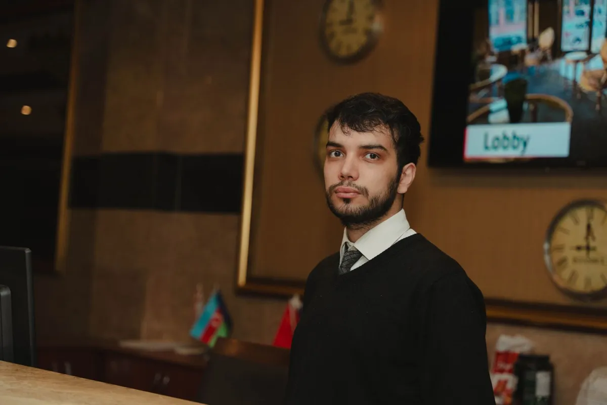 Receptionist at a hotel front desk