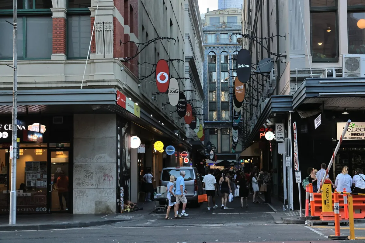 Shops and pedestrians in a Melbourne laneway