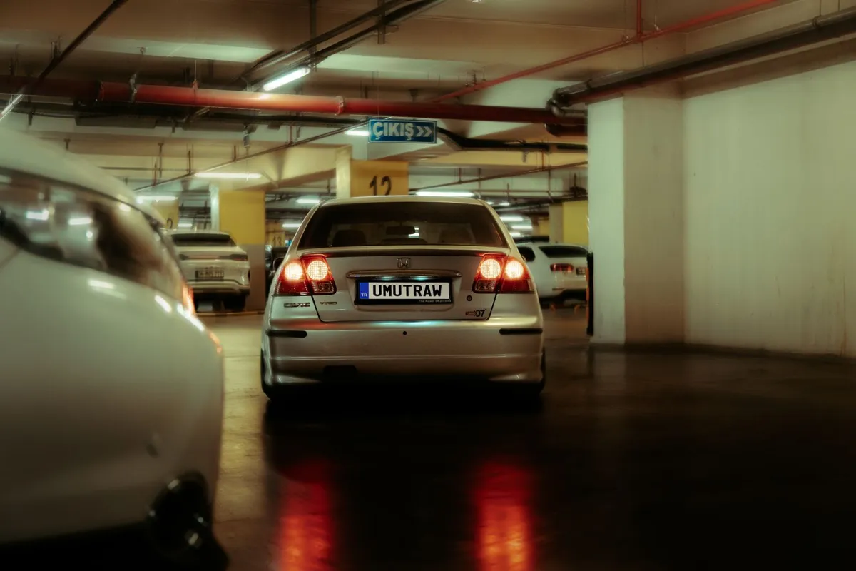 A car parked inside an underground parking garage