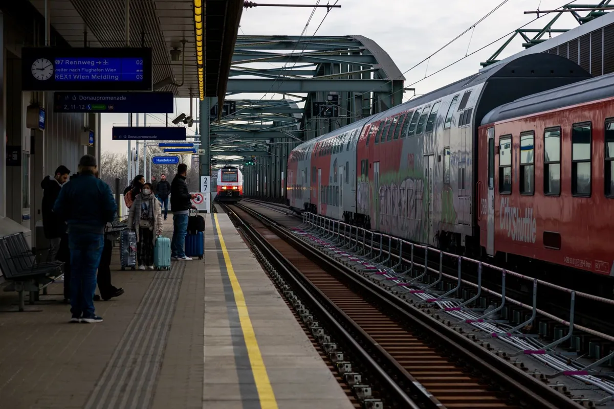Passengers waiting on a railway platform
