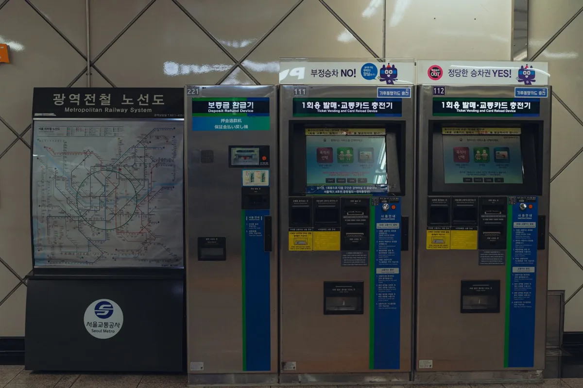 Transit map and ticket machines in a metro station